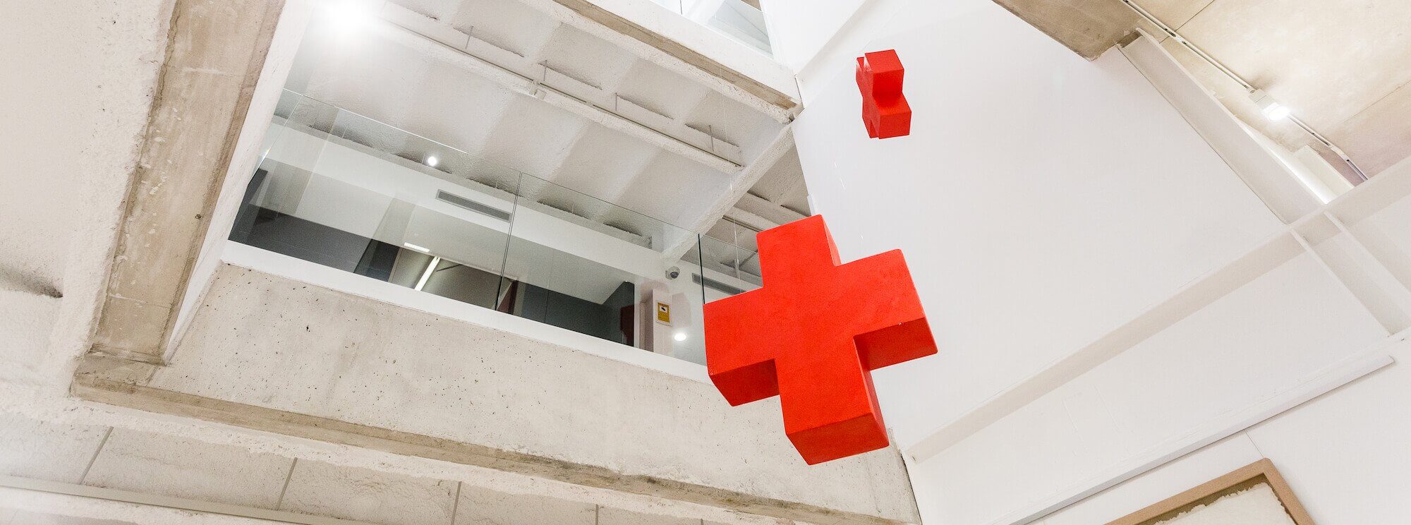 Large open foyer with Red Cross emblem hanging