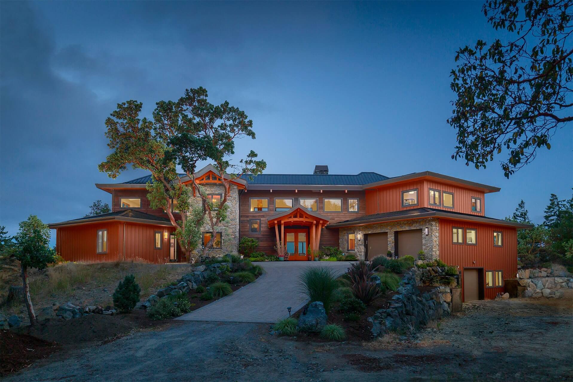 Full home view of Olympic Panorama with large entryway and driveway