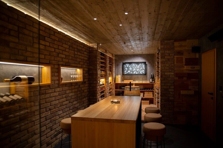 Wine cellar with storage and seating area