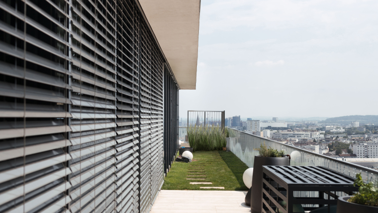 Slightly opened external venetian blinds on a smart home.